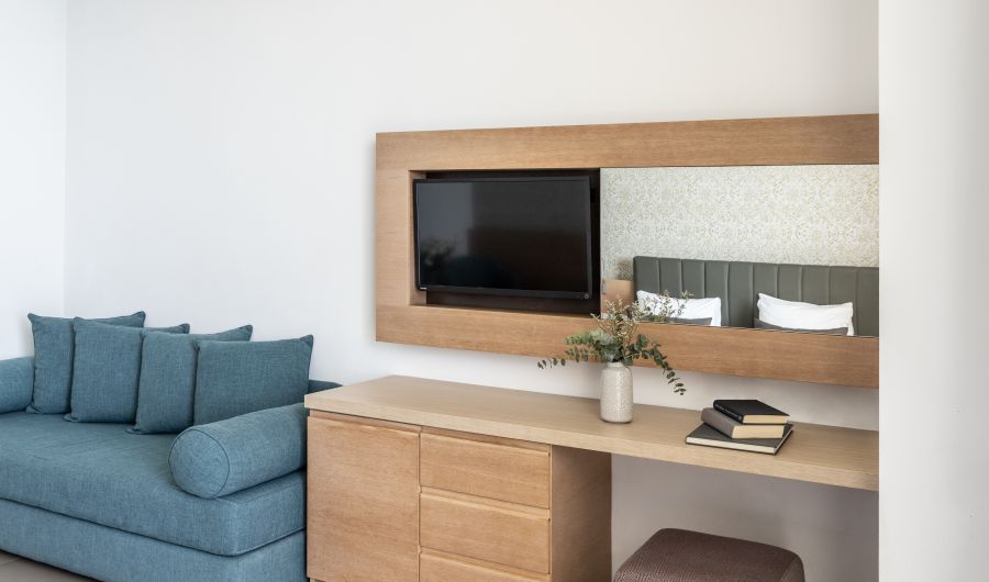 Royal Apollonia Limassol Deluxe room sea couch and tv