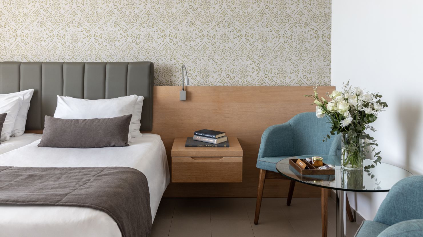 Royal Apollonia Limassol Deluxe room sea view bed and chair
