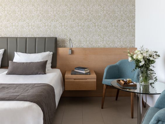 Royal Apollonia Limassol Deluxe room sea view bed and chair