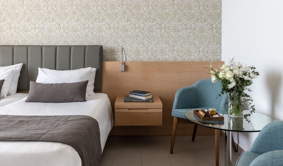Royal Apollonia Limassol Deluxe room sea view bed and chair