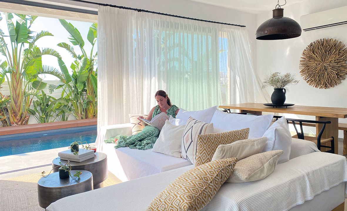 Protaras Lora Pearl Villa woman reading on the couch