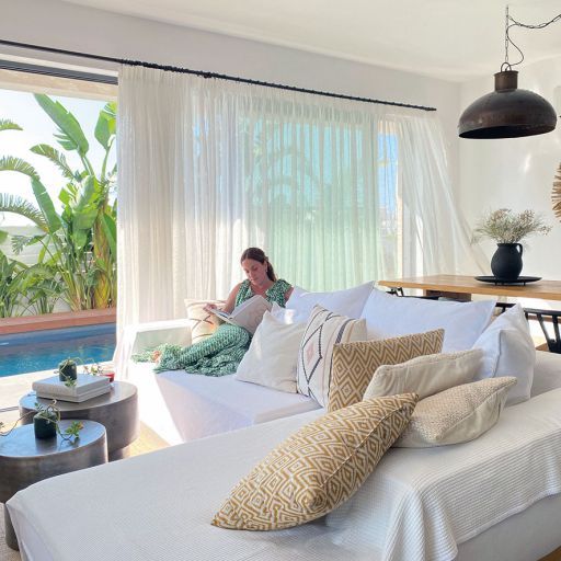 Protaras Lora Pearl Villa woman reading on the couch