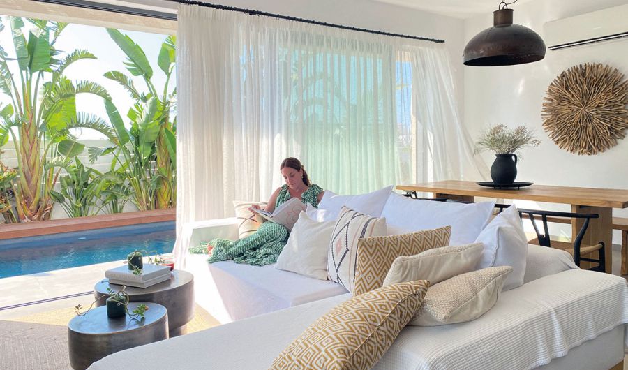 Protaras Lora Pearl Villa woman reading on the couch
