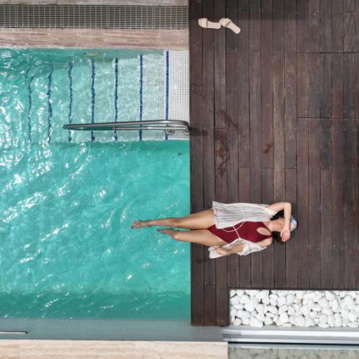 Nausicaa Villas Protaras exterior pool woman sunbathing
