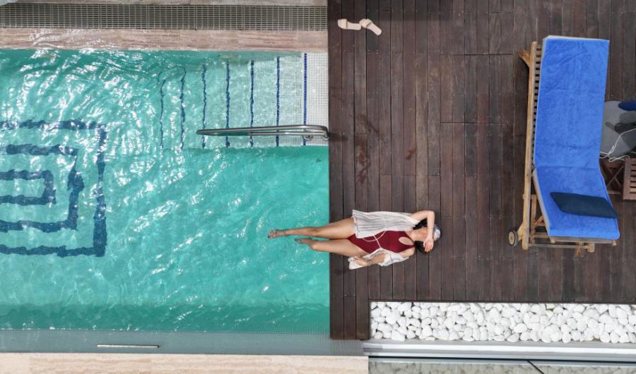 Nausicaa Villas Protaras exterior pool woman sunbathing