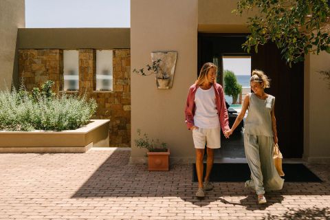 Amada Villas in Rhodes Greece exterior couple standing on the villa's entrance