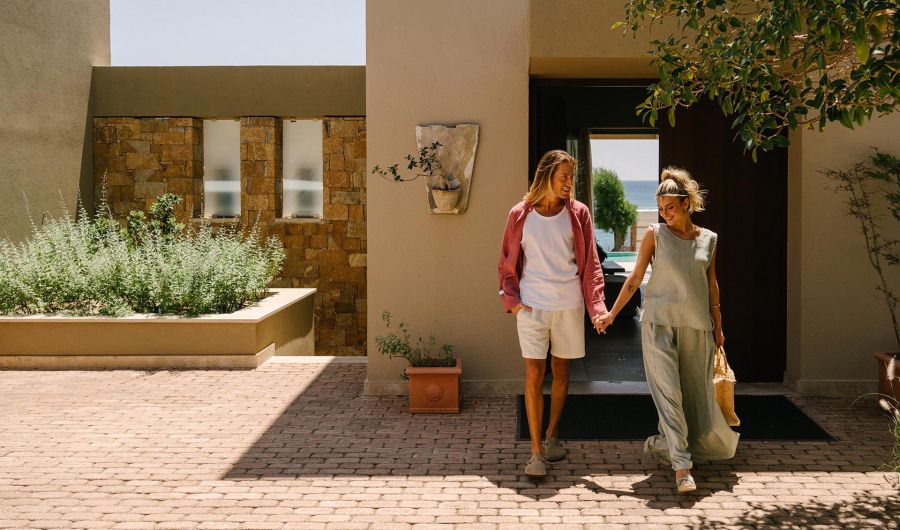 Amada Villas in Rhodes Greece exterior couple standing on the villa's entrance