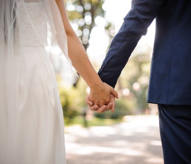 Imperial Island couple at wedding reception holding hands