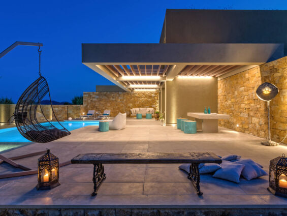 Amada Colossos room terrace with nightlights and pool