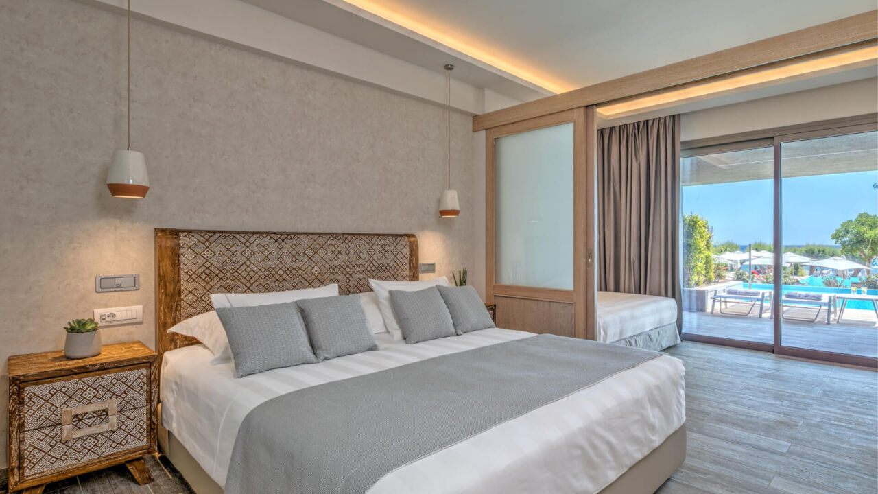 Amada Colossos room bedroom with pool view