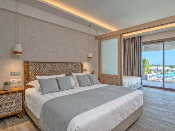 Amada Colossos room bedroom with pool view