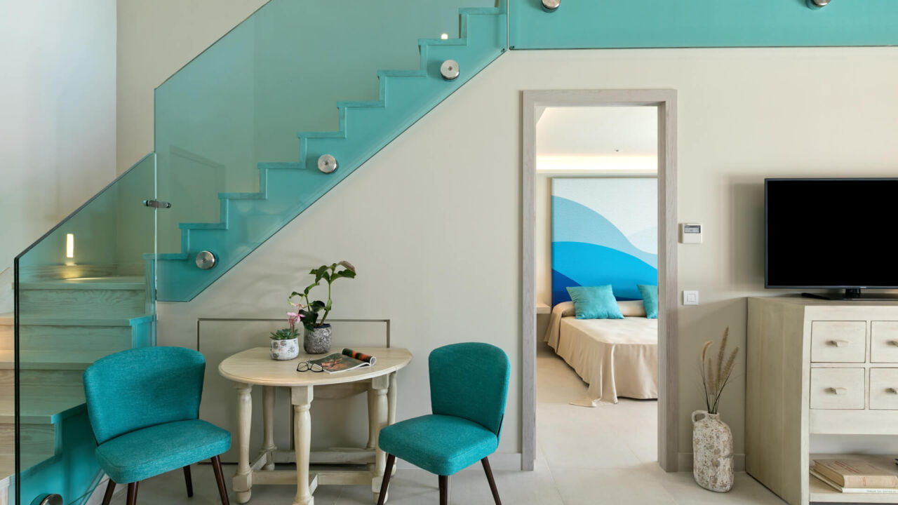 Amada Colossos room sitting area and stairs