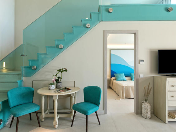 Amada Colossos room sitting area and stairs