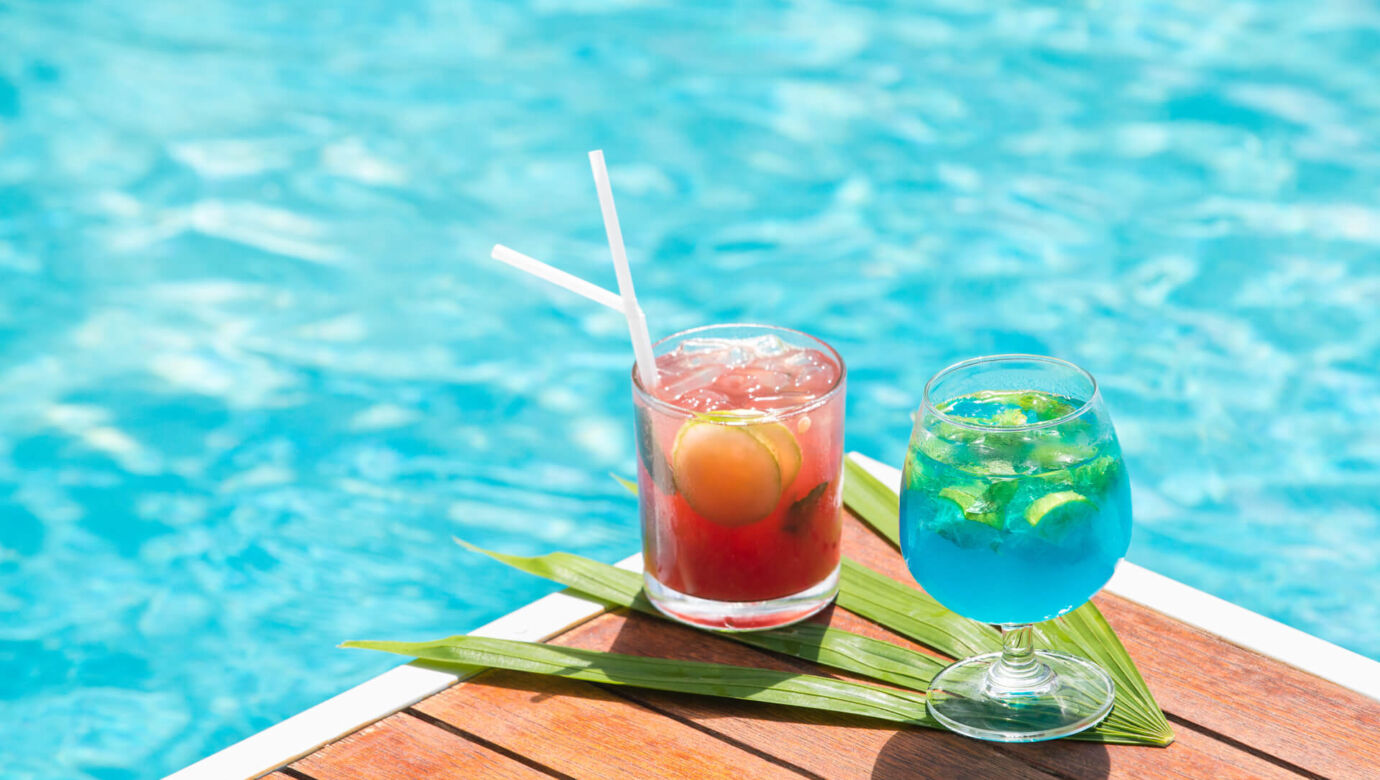 Two Cocktails at table at pool side