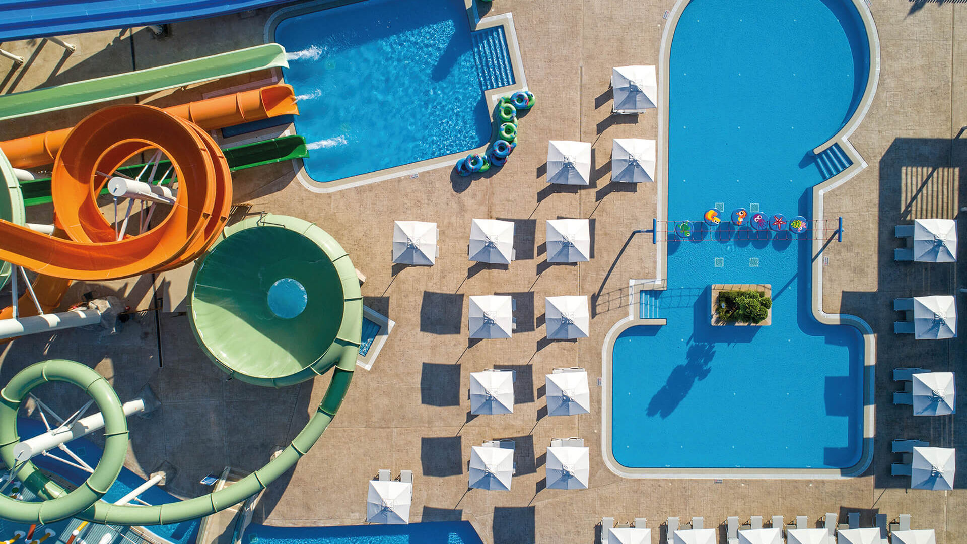 Aerial view of Amada Colossos waterpark slides pools and sunbeds