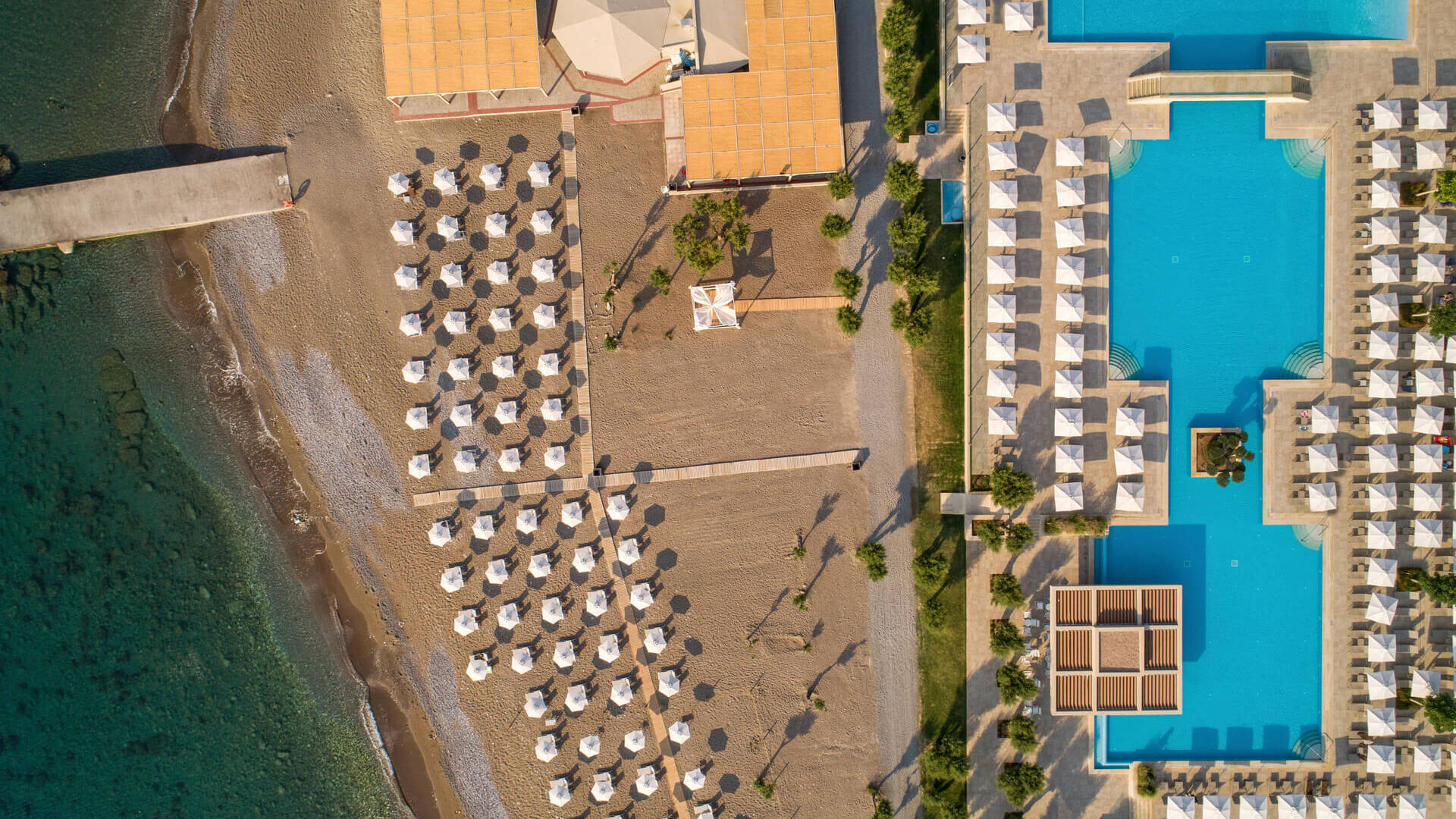 Aerial view of Amada Colossos complex with pool and beach area