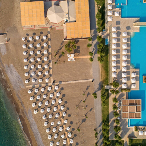 Aerial view of Amada Colossos complex with pool and beach area