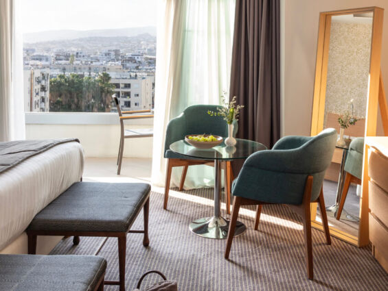 Royal Apollonia Deluxe suite sitting area and balcony