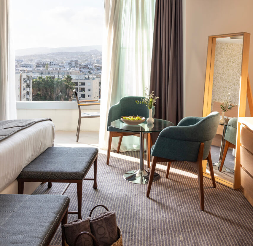 Royal Apollonia Deluxe suite sitting area and balcony
