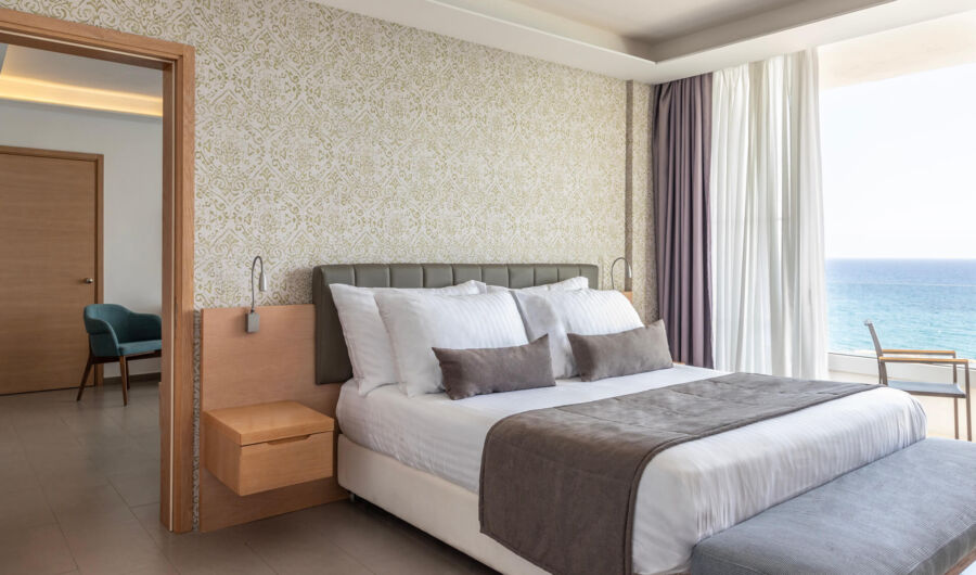 Royal Apollonia Executive suite bedroom and sea view