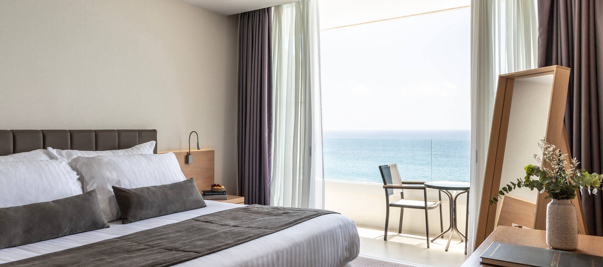 Royal Apollonia Honeymoon suite bedroom and balcony