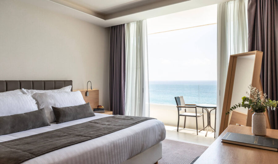 Royal Apollonia Honeymoon suite bedroom and balcony