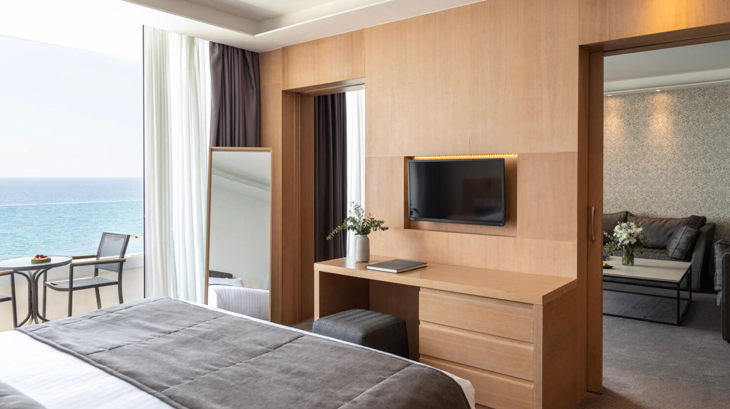 Royal Apollonia Honeymoon suite bedroom and sitting area