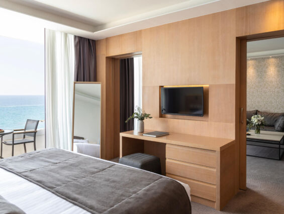 Royal Apollonia Honeymoon suite bedroom and sitting area