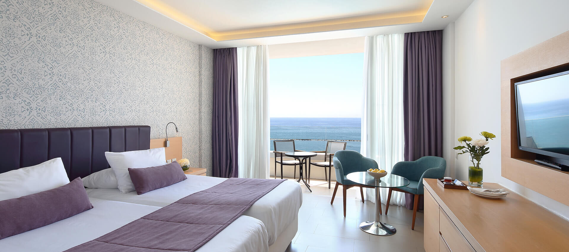 Royal Apollonia Superior Room bedroom and balcony