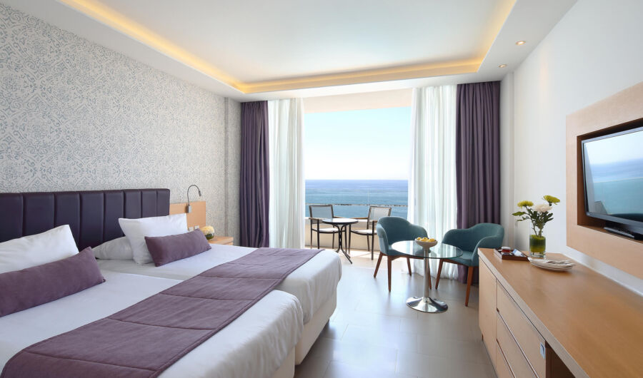 Royal Apollonia Superior Room bedroom and balcony