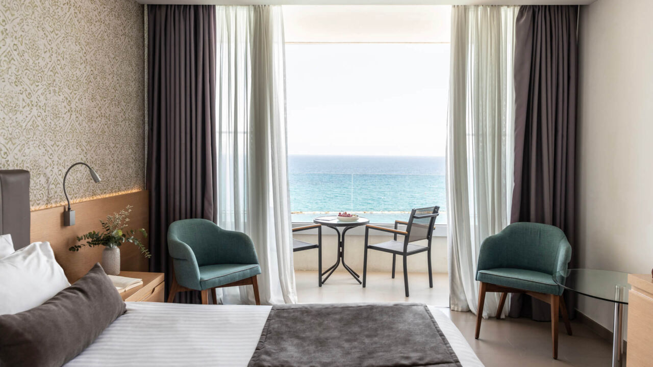 Royal Apollonia Superior Room bedroom with sea view