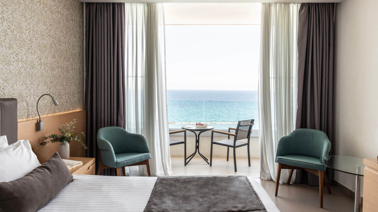 Royal Apollonia Superior Room bedroom with sea view