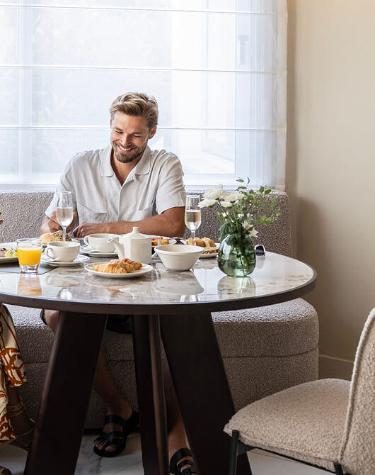 Couple enjoying breakfast at Cali Resort & Spa