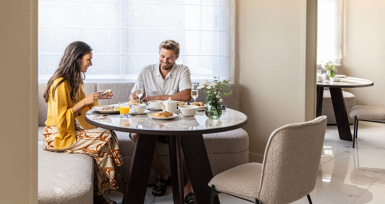Couple enjoying breakfast at Cali Resort & Spa