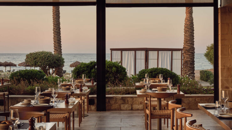 Outdoor tables ready for dinner at Asterion Suites restaurant