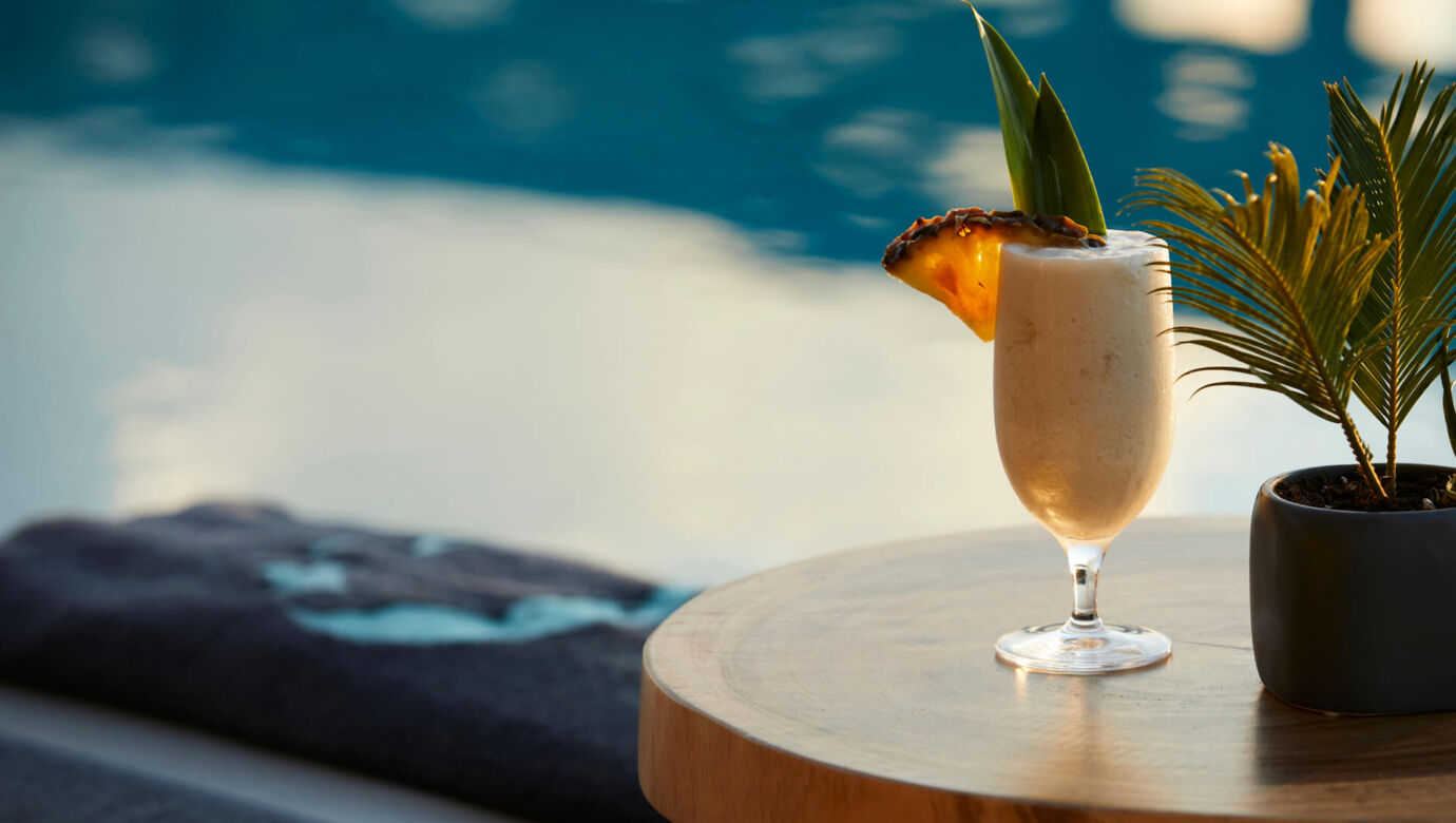Cocktail pool side on a table at Asterion Suites