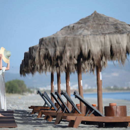 Woman Seeing the sea at beach of Asterion Suites
