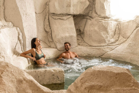 Man and woman in indoor bathtub