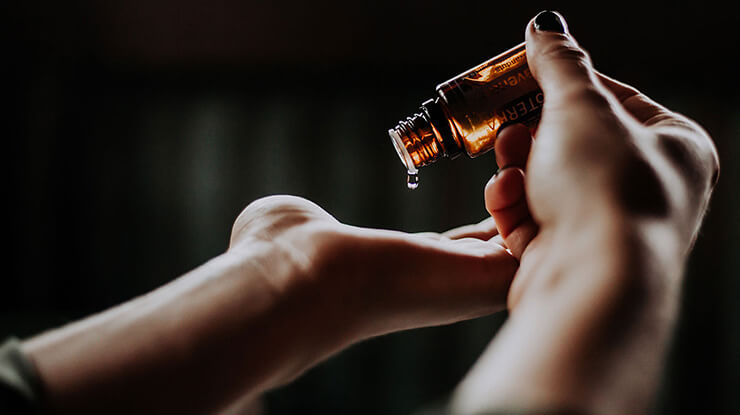 Essential oil being applied to the skin