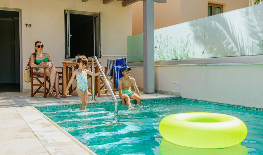 Family relaxing at St.Elias Suite private pool