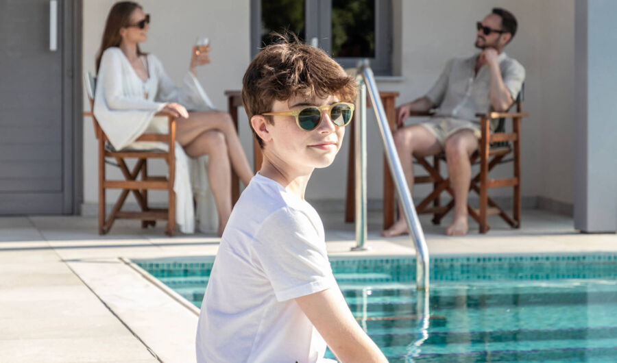 Family relaxing at St.Elias Suite private pool