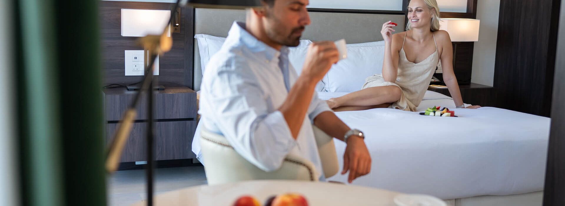 Couple relaxing at Hilton Nicosia room