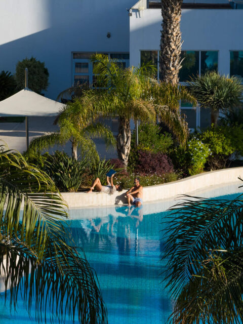 Couple relaxing at pool