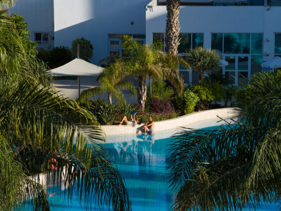 Couple relaxing at pool