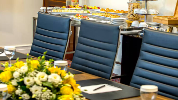 Hilton Nicosia meeting room with chairs and flowers
