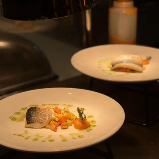 Two modern plated dishes at Imperial Island Restaurant