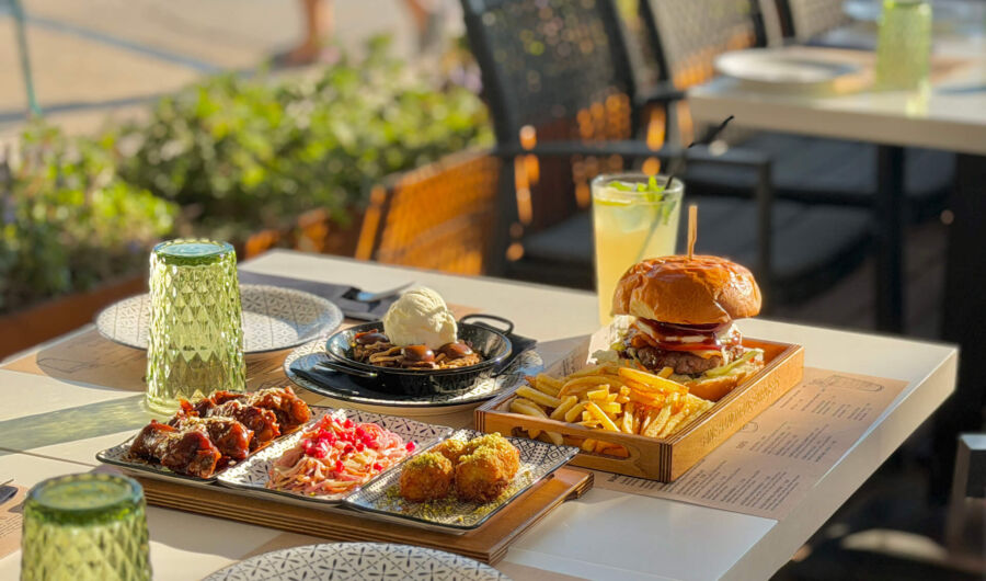 Table with many appetizers and food at Imperial Island Resort served outside