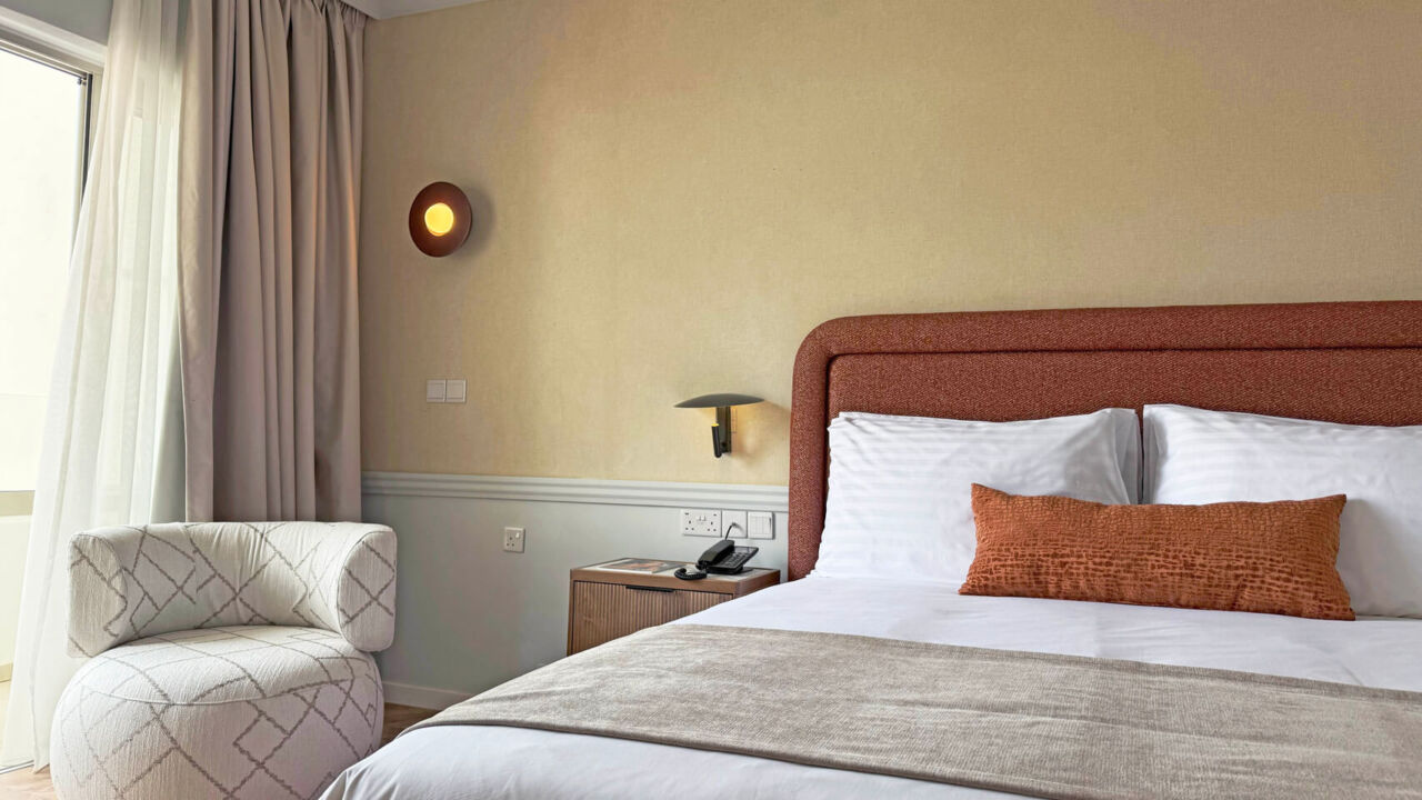 Imperial Island Superior Room bed and window