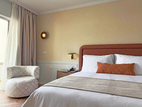 Imperial Island Superior Room bed and window