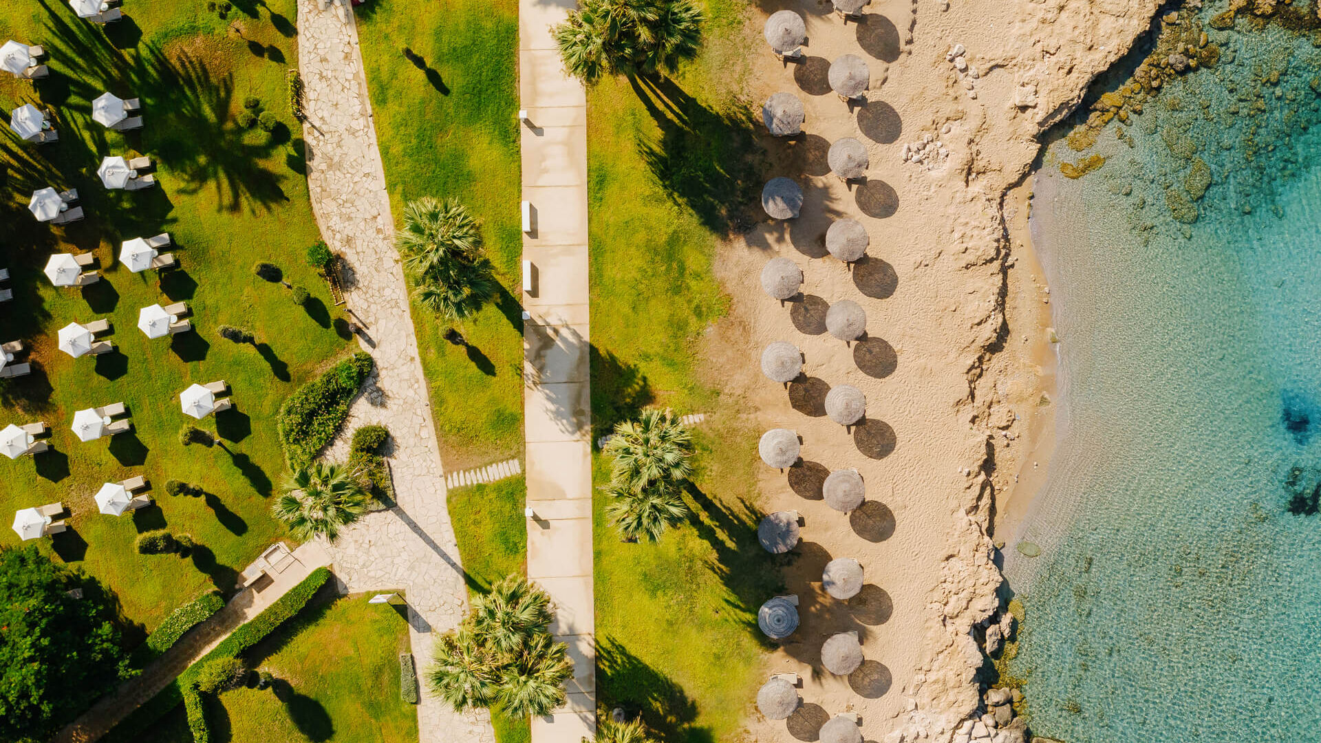 Imperial Island Resort beach with umbrellas and sunbeds